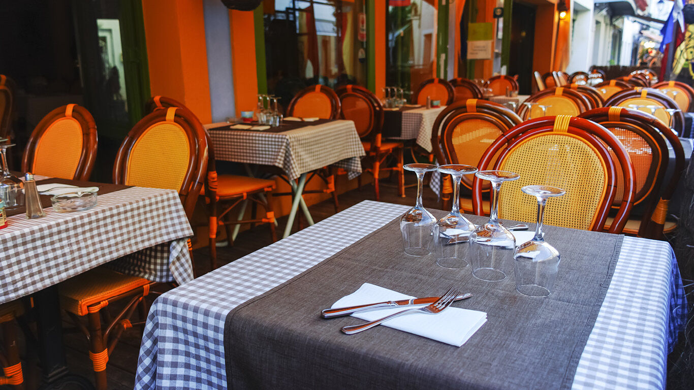 Resturant tables set for dinner. 